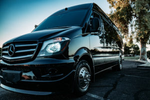 Scottsdale Party Bus black Sprinter driver side angle